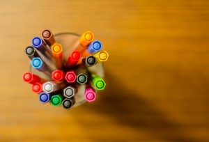 A cup of colorful pens
